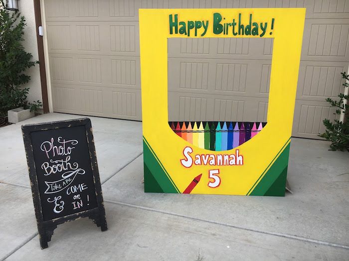 a birthday sign and chalkboard in front of a garage