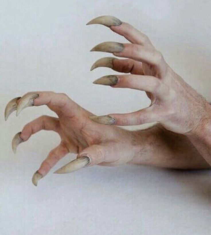 two hands with long nails and claws spread out