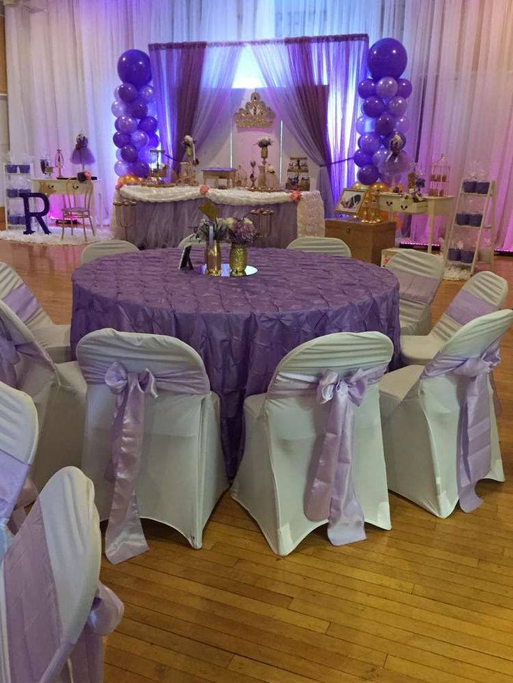 a banquet room with purple and white decor