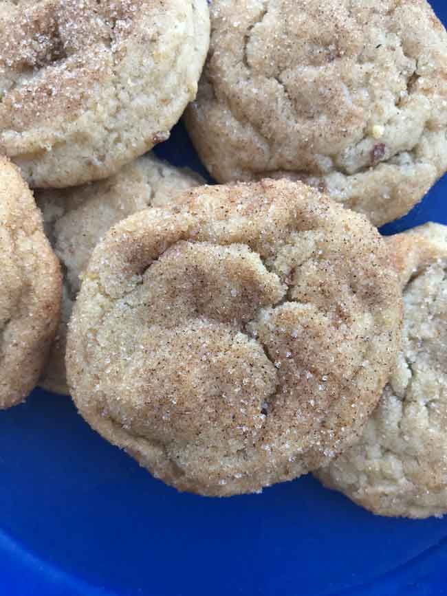 some sugar cookies are on a blue plate