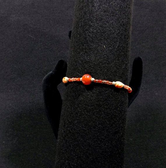 Orange Glass Bead Boho Bracelet by KatsCache on Etsy Adjustable Orange Beaded Spiritual Bracelet, Orange Spiritual Beaded Bracelets, Adjustable Orange Spiritual Beaded Bracelet, Spiritual Orange Adjustable Beaded Bracelets, Adjustable Coral Beaded Bracelets With Colorful Beads, Handmade Adjustable Orange Bracelets, Adjustable Handmade Orange Bracelet, Adjustable Handmade Orange Bracelets, Bohemian Czech Glass Orange Beaded Bracelets