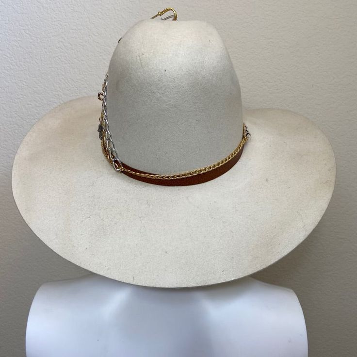 Mexican Handcrafted Wide Brim Cowboy Hat | Lucky7 Beige Just Different! A complete head-turner & unique Men & Women Mexican artisan hat on this wool felt Tejana-form in Beige color with its 7 symbolical Gold-dipped accessories, steel accessories, & leather hat-band. SIZE See “Size Chart” below, or CLICK HERE DETAILS Sombrero Box Inner-elastic band (comfortable sizing) Adjustable High Crown Fur Felt Fedora, Adjustable Fur Felt Fedora With High Crown, Adjustable High Crown Fedora In Fur Felt, Felt Hat Bands For Rodeo, Felt Hat Bands For Rodeo With Flat Brim, Adjustable Felt Hat Band For Fedora, Adjustable Felt Fedora Hat Bands, Festival Felt Hat With Short Brim, Artisan Felt Hat For Rodeo, One Size