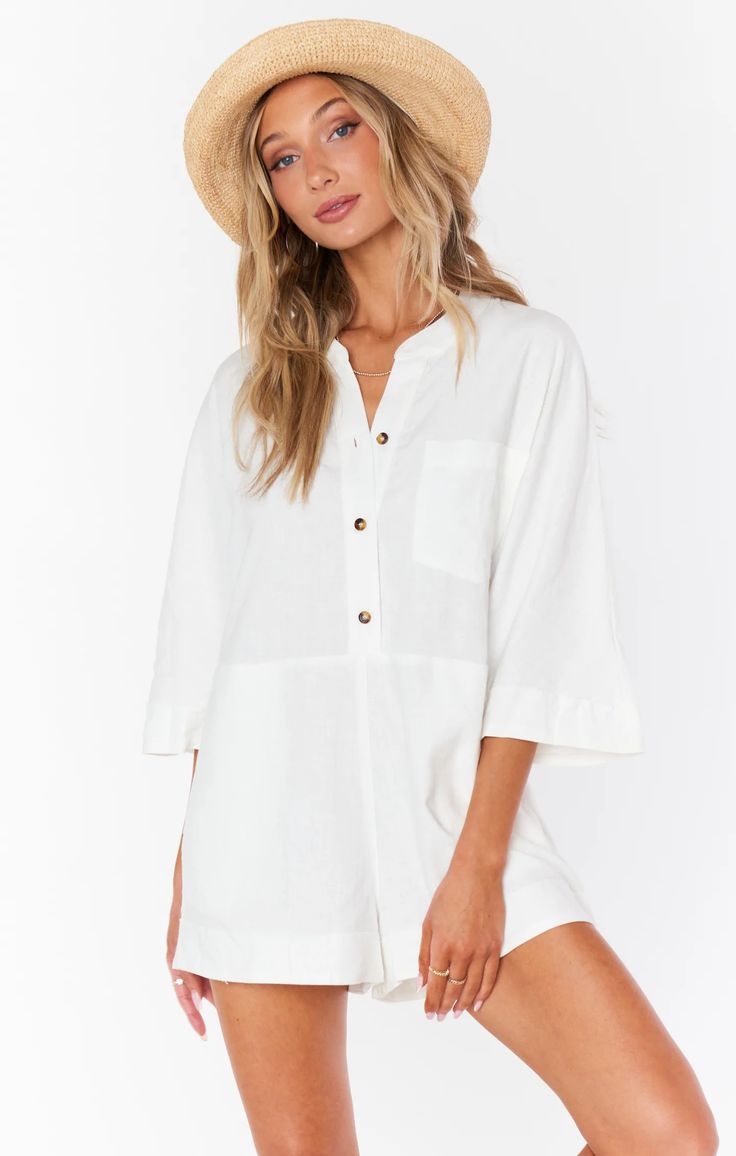 This oversized linen romper is perfect for warm weather, her lightweight linen fabric lends a breezy feel, and her front buttons allow you to wear her buttoned up or unbuttoned for a more relaxed look. Wear her as a coverup to the beach or out to brunch with your gals, with Horton the options are endless. Summer Jumpsuits And Rompers With Relaxed Fit, Chic Short Sleeve Jumpsuits And Rompers For Beach, Chic Linen Dress With Buttons For Beach, Summer Beach Linen Jumpsuits And Rompers, Relaxed Summer Beach Jumpsuits And Rompers, Summer Relaxed Fit Jumpsuits And Rompers For Beach Season, Summer Vacation Button-up Jumpsuits And Rompers, Cotton Short Sleeve Jumpsuits And Rompers For Beach, Relaxed Fit Jumpsuits And Rompers For Beach