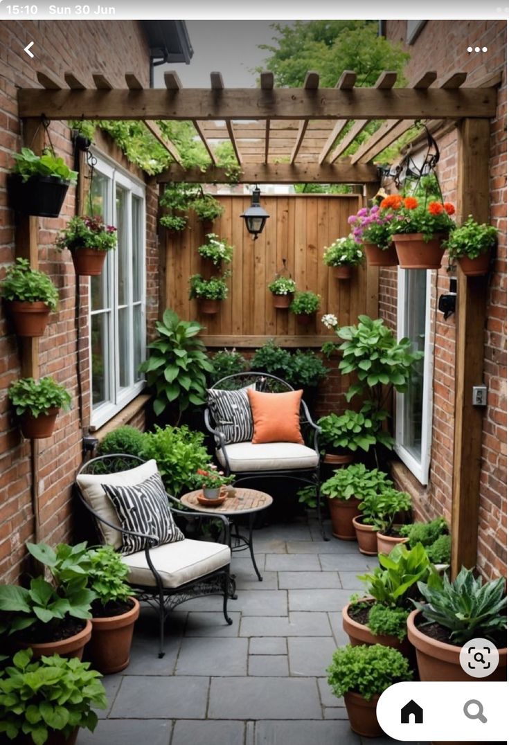 an outdoor patio with potted plants and chairs