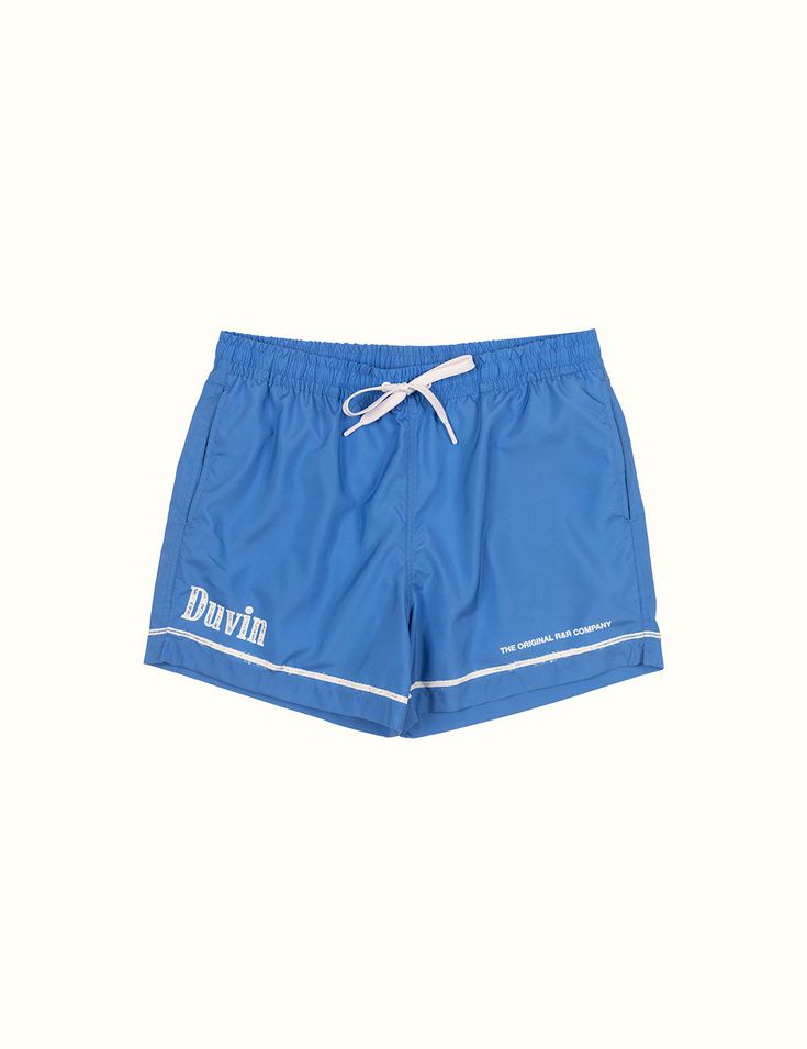 Our elastic Swim Shorts are your new go-to for leisurely days in the sun. These vintage trunks are made of 100% poly in a comfort short / wide fit. Every pair is equipped with a tearaway size tag for max waist comfort. Meet your new favorite beach trunk. Pair it with your favorite Duvin tee and hat. 100% Polyester Wide-leg relaxed fit Tearaway size tag 14.6'' size Medium outseam (scales up and down depending on size - we recommend sizing up if you want a little length 5'' inseam Premium soft box Summer Blue Athletic Shorts For Poolside, Blue Athletic Shorts For The Beach, Blue Athletic Shorts With Elastic Waistband For Beach Season, Retro Blue Bottoms For Poolside, Blue Summer Athletic Shorts, Sporty Blue Athletic Shorts For Poolside, Summer Blue Moisture-wicking Athletic Shorts, Blue Athletic Shorts With Elastic Waistband For Vacation, Moisture-wicking Blue Bottoms For Summer