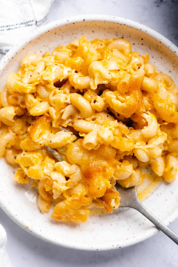 a white bowl filled with macaroni and cheese