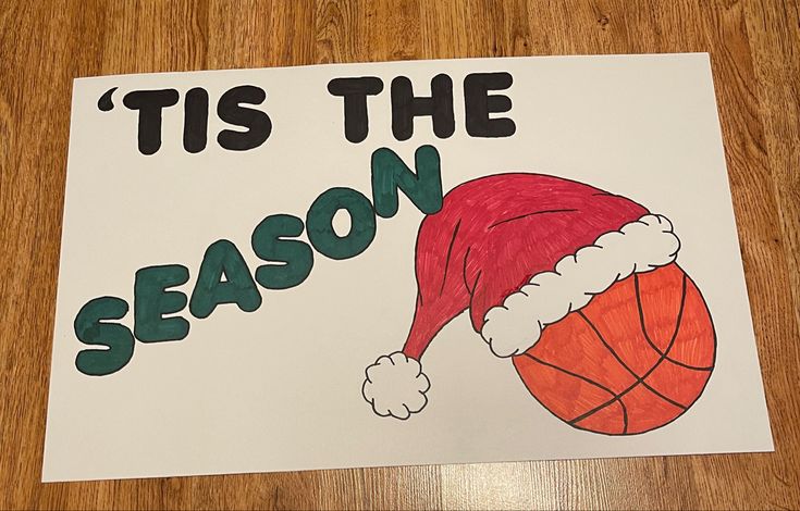 a christmas card that says tis the season with a basketball in a santa's hat