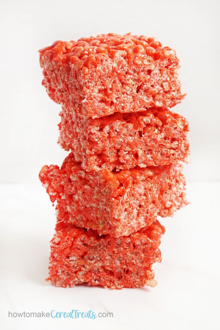 some kind of food that is stacked on top of each other in front of a white background