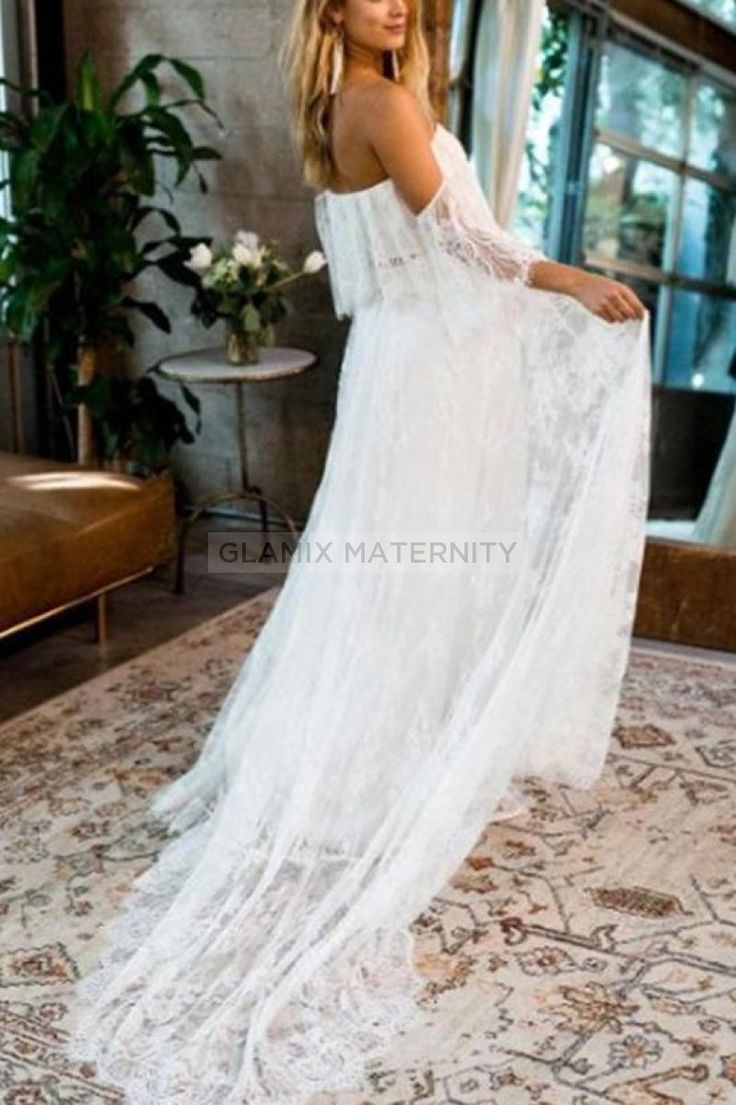 This off the shoulder wedding gown is truly timeless elegance! Made with a premium stretch material and lace ruffle and train, this gown is equally stunning and comfortable. This is a gorgeous pregnancy wedding dress that will have all eyes on you! Content + Care Neckline: Off-the-shoulder. Pattern Type: Solid. Sleeve: Short Sleeves. Season: Spring, Summer, Fall, Winter. Material: Lace. Hand Wash Cold, No Bleach, Hang or Line Dry Size + Fit Length: Floor(72''-based on size M). Casual, Photoshoot White Lace Maternity Wedding Dress, White Lace Maternity Dress For Wedding, White Lace Maternity Gown, Off-shoulder Wedding Gown With Sweep Train, Fitted Lace Maternity Dress For Wedding, White Floor-length Maternity Dress For Wedding, Fitted Maternity Wedding Dress With Sweep Train, Fitted Maternity Dress With Sweep Train For Wedding, Elegant Wedding Maternity Dress With Lace Trim