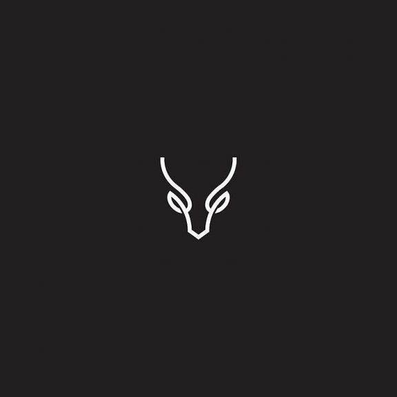 an animal's head is shown in the middle of this minimalistic black and white logo