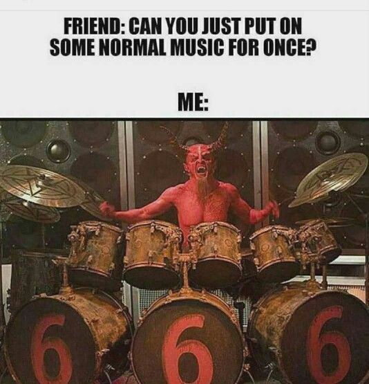 a man with horns on his head is playing drums and has the number six in front of him