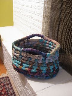 a stack of multicolored rugs sitting on top of a window sill