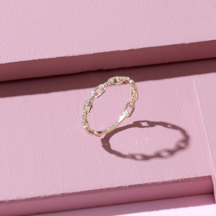 The Open Link Ring has a sensational design with the elegantly embroidered oval chains embellished and connected with glittering stones which will shine like the brilliance of a constellation. - Made in 10k or 14k solid gold - Decorated with handset white cubic zirconia stone - Band Width: 3.36 mm / 0.13 inches - Thickness: 1.00 mm / 0.03 inches -This product comes with iconic Norm Jewels gift box Twisted Gold Ring, Gold Chain Ring, Chain Link Ring, Handmade Gold Ring, Link Ring, Gold Link Chain, Solid Gold Band, Linking Rings, Rose Gold Band