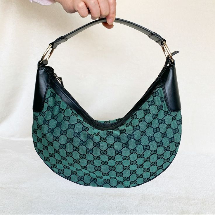 The Hobo Bag Is Back! Chic And Cute! Gg Canvas Green/Abony Color Pattern Black Leather Trim Leather Shoulder Handle W/ D Rings Zip Closure Inside Fabric Liner Fully Lined Inside Zip Pocket Measurements Approximately 15in L X 8in H X 3in D, Drop 8in To 10in. Green Gucci Bag For Everyday Use, Green Gucci Shoulder Bag For Evening, Gucci Green Shoulder Bag For Evening, Green Gucci Shoulder Bag For Daily Use, Daily Use Green Gucci Shoulder Bag, Gucci Green Shoulder Bag For Daily Use, Green Gucci Bag With Gold-tone Hardware, Gucci Green Bags With Gold-tone Hardware, Gucci Designer Handheld Shoulder Bag