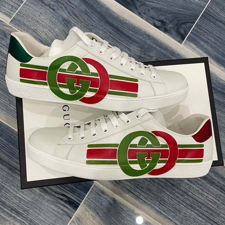 Husband Needs A Us 10.5 And They Are Sold Out!!! My Loss Your Gain. The Gucci New Ace Playfully Modernizes The Traditional Athleisure Sneaker With Interlocking Gg And Athletic Stripes. The Fashion House's Signature Green And Red Color Combo Recalls Heritage Themes Set Against An All-White Silhouette. A Solid Rubber Heel Makes This Low-Top A Lasting Wardrobe Addition. Designer Sneakers With Logo Detail And Round Toe, Custom Round Toe Sneakers With Logo For Sports, Custom Round Toe Sneakers For Sports With Logo Detail, Gucci Classic Sneakers For Streetwear, Classic Gucci Sneakers For Streetwear, White Gucci Sneakers With Logo Detail, Casual Leather Custom Sneakers With Logo Detail, Gucci Low-top Custom Sneakers For Sports, Gucci Low-top Sneakers With Logo Detail