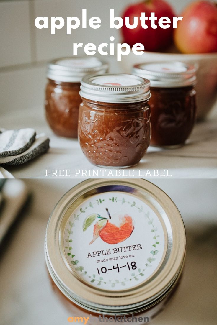 three jars filled with apple butter sitting on top of a counter next to an empty jar