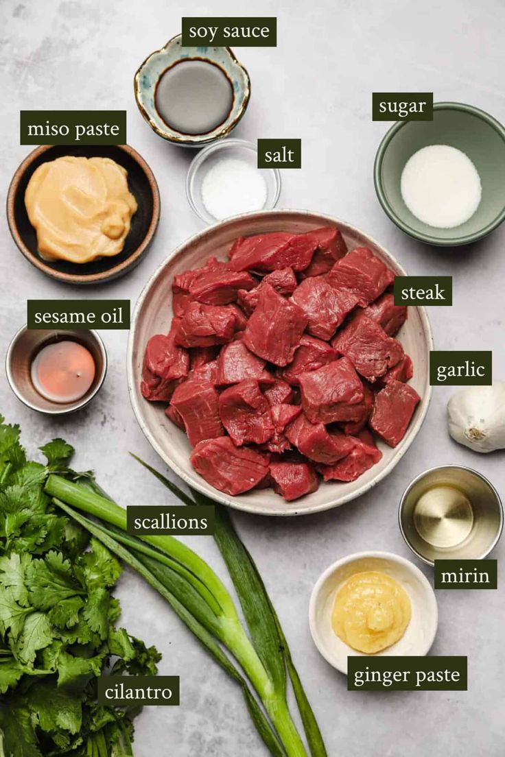 ingredients to make beef sauce laid out on a white counter top with green onions, celery and mayonnaise