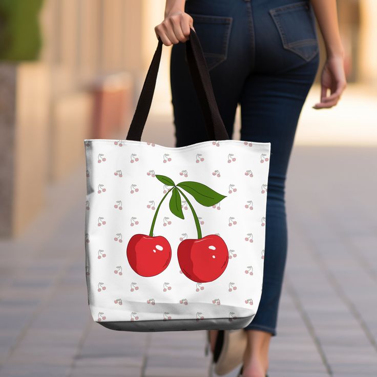 🍒 Cherry Coquette Print Tote Bag - Sweet & Stylish Accessory! 🌸 Indulge in the whimsical charm of our Cherry Coquette Print tote bag! Adorned with delightful cherry motifs and flirty accents, this bag is perfect for adding a touch of sweetness to your everyday ensemble. Features: 👜 Chic and compact design (16" x 16") for easy carrying of essentials. 🍒 Vibrant cherry coquette print adds a pop of color and personality. 💃 Durable canvas material ensures long-lasting use and style. 🌸 Perfect for trips to the farmer's market, picnics, or a day out with friends. 🎨 Available in a variety of colors to suit your personal taste. Elevate your look with the playful charm of our Cherry Coquette Print tote bag. Whether you're running errands or enjoying a day out, this adorable accessory is sure Cute Rectangular Shoulder Bag For Gifts, Cute Rectangular Shoulder Bag - Gift Idea, Cute Rectangular Shoulder Bag As Gift, Cute White Bags For Valentine's Day, Cute White Bag For Valentine's Day, Kawaii Rectangular Canvas Bag Gift, Cute Red Bags For Gifts, Cute Red Bag For Gift, Cute Red Bags For Valentine's Day