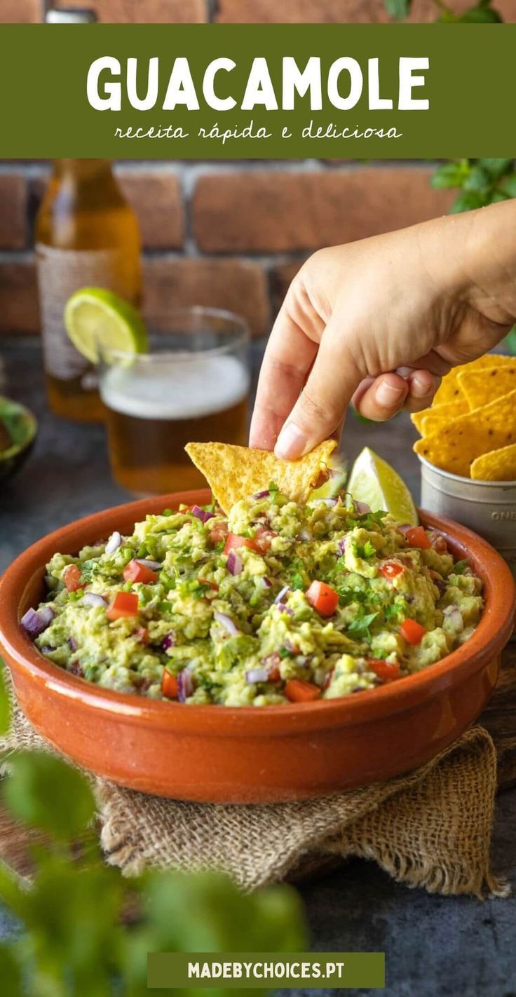 guacamole in a bowl with tortilla chips and salsa on the side