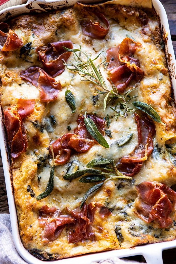 a casserole dish with cheese, bacon and herbs