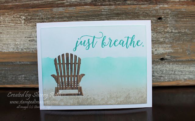 a card that says just breathe with a wooden chair on the beach in the background