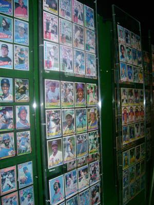 many baseball cards are displayed on the wall