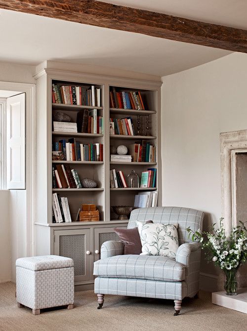 a living room filled with furniture and bookshelves