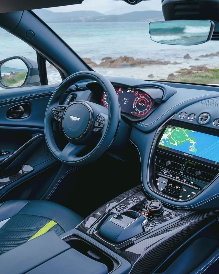 the interior of a sports car with dashboard, steering wheel and dash board showing on screen