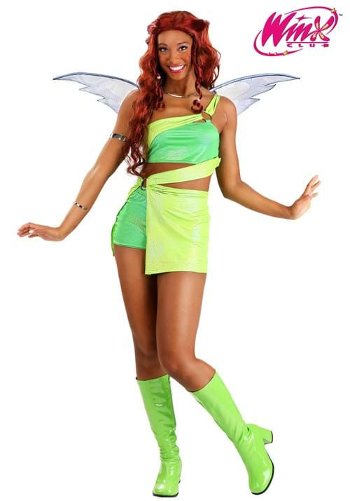 a woman dressed in a green and yellow costume with wings on her head, posing for the camera