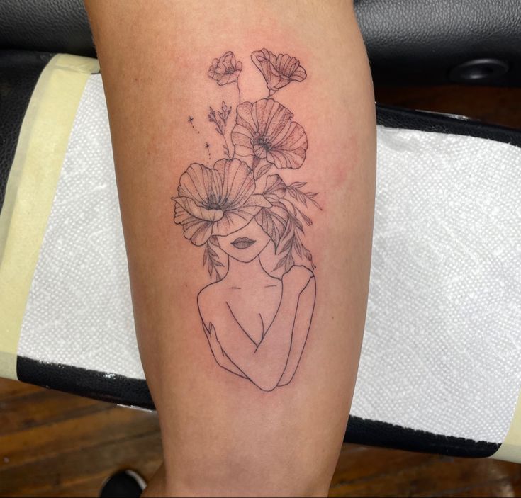 a woman with flowers in her hair on the leg