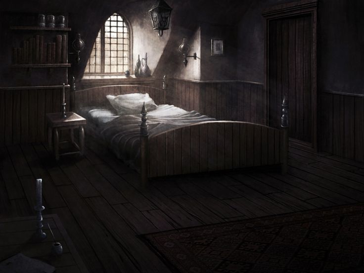 a bed in a dark room next to a window with light coming through the windows