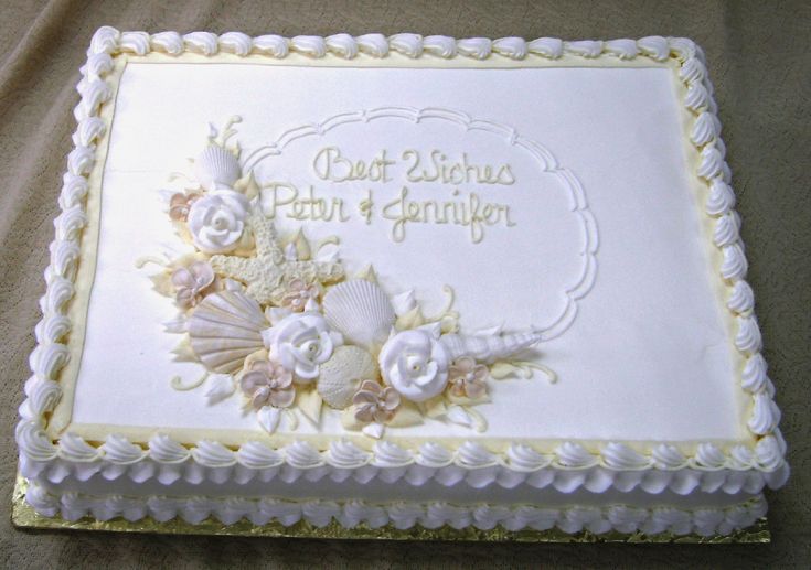 there is a white cake with flowers on it