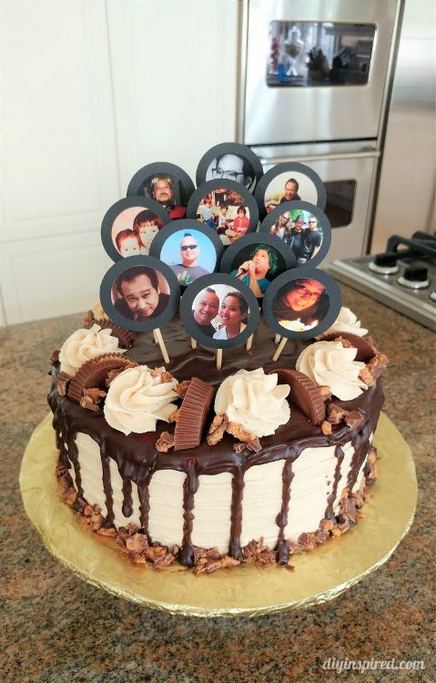 a cake that is sitting on top of a table with photos in the icing