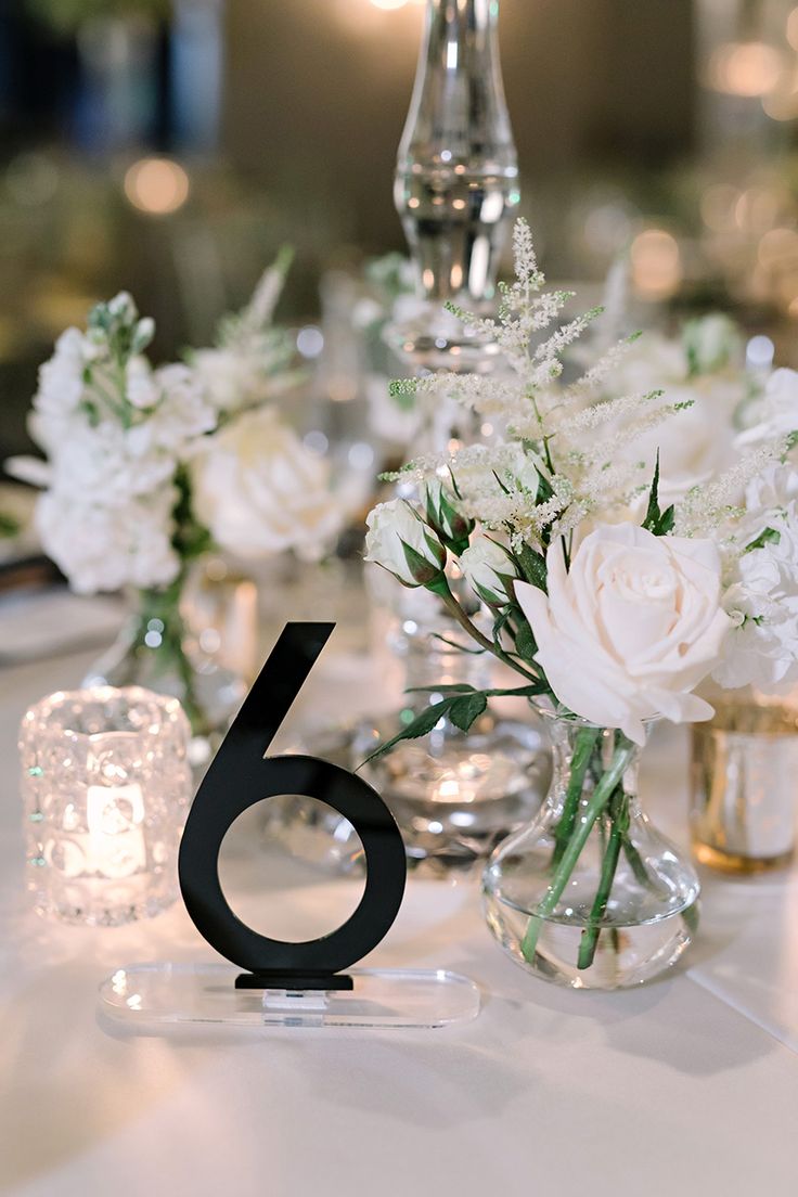 an instagram page with flowers in vases and candles on the table for a wedding