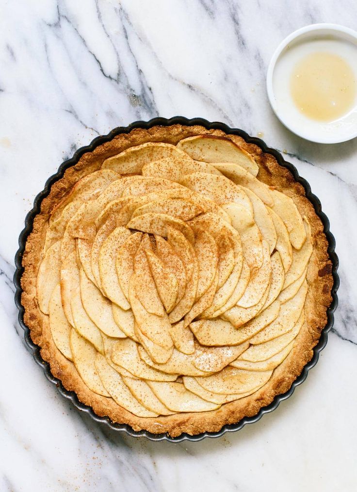 an apple pie on a marble counter top