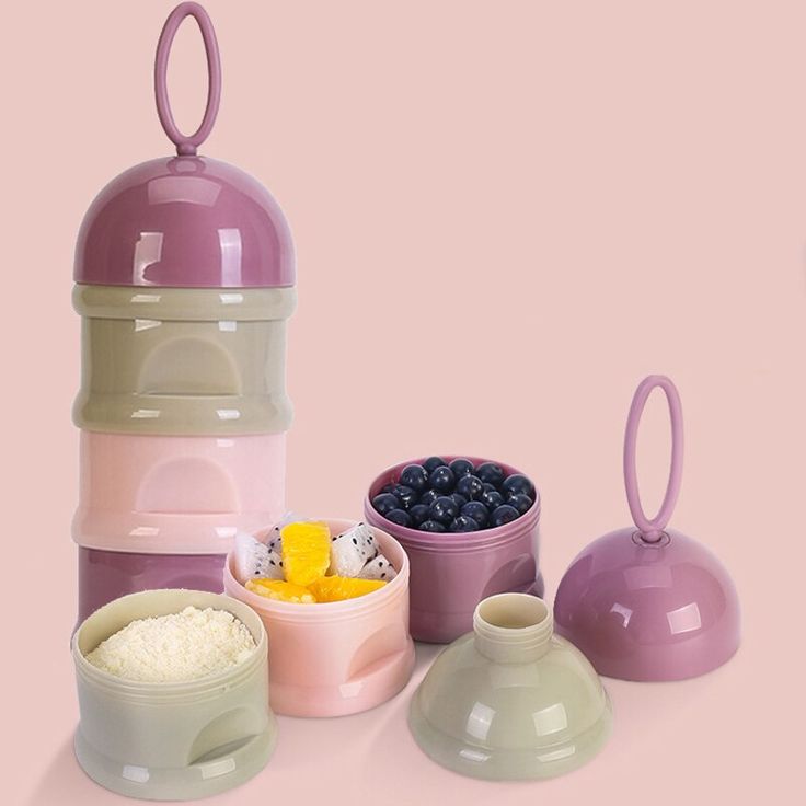 there are three bowls and two containers with food in them next to each other on a pink background