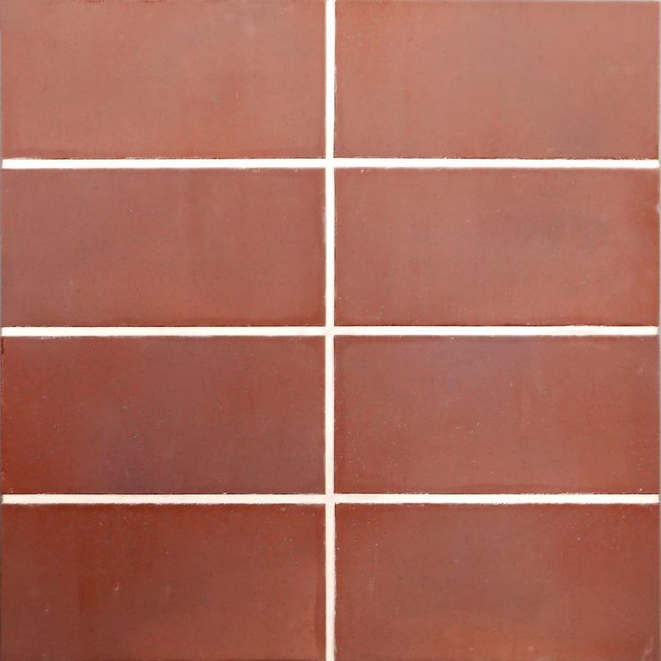 a red tiled wall with white lines on it