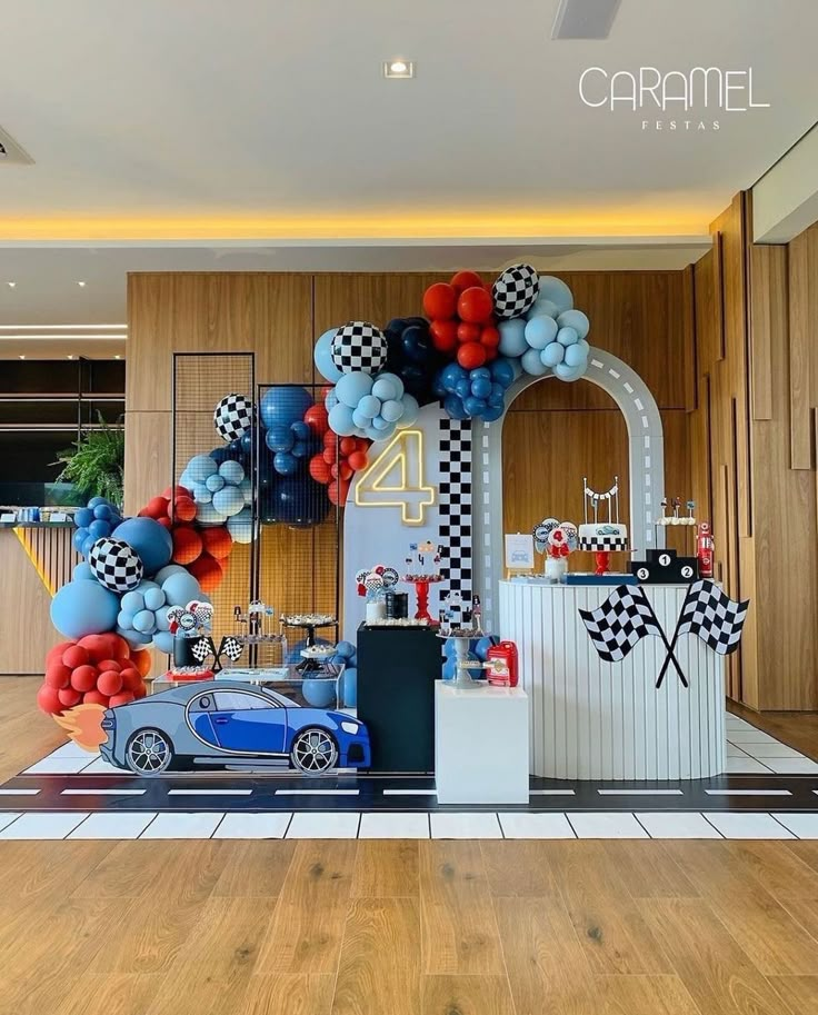 a car themed birthday party with balloons and decorations