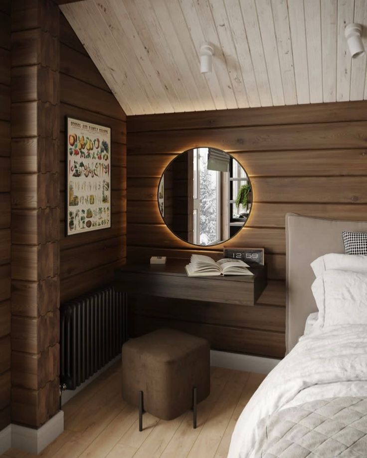 a bedroom with wood paneling and a round mirror on the wall