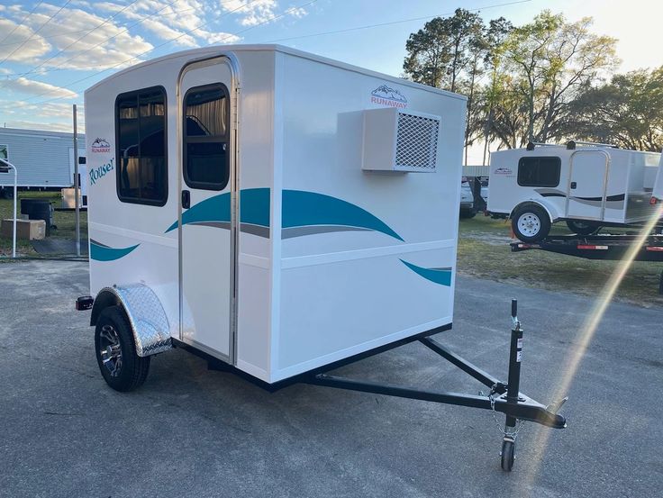 a white trailer parked in a parking lot