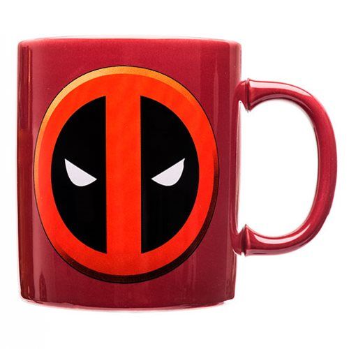 a red coffee mug with a deadpool logo on the front and eyes painted on it