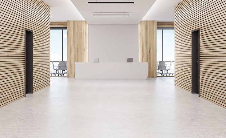 an empty white room with wooden slats on the walls