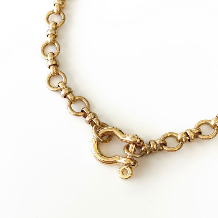 Lo Necklace – Anima Mea Brass Gold Chain Link Necklace, Gold-tone Brass Necklace With Cable Chain, Brass Jewelry With Oval Link Cable Chain, Classic Gold Toggle Necklace With Chunky Chain, Vintage Gold Toggle Chain Necklace, Brass Link Necklace With Cable Chain, Classic Gold-tone Brass Necklaces, Vintage Brass Link Necklace, Gold-tone Chain Link Brass Necklaces