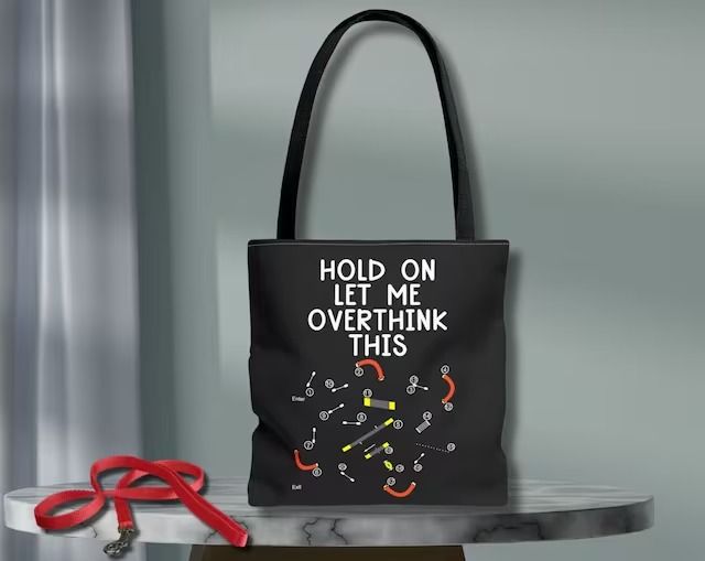 a black tote bag with the words hold on let me overthik this