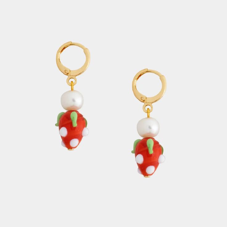 They say that there is no greater accessory than a smile! Wearing the Pippa Strawberry and Pearl Earrings will make it easy to smile. We adore these whimsical strawberry earrings that are ideal for bringing a unique touch to your outfit. Whether you are wearing them or gifting them to a friend, these earrings can’t help but make you smile! Approximately 1.4 inches long Freshwater pearl Glass strawberry bead 14K gold plated Hypoallergenic Nickel-free and lead-free Do not drop or throw jewelry ont Playful Jewelry Set With Drop Earrings, Playful Jewelry Set With Matching Drop Earrings, Playful Jewelry With Fruit Design For Gift, Playful Fruit Design Jewelry For Gifts, Pink Fruit Design Earrings, Playful Hoop Earrings As Gift, Trendy Fruit Design Drop Earrings, Cute Fruit Design Earrings, Trendy Dangle Earrings With Fruit Design