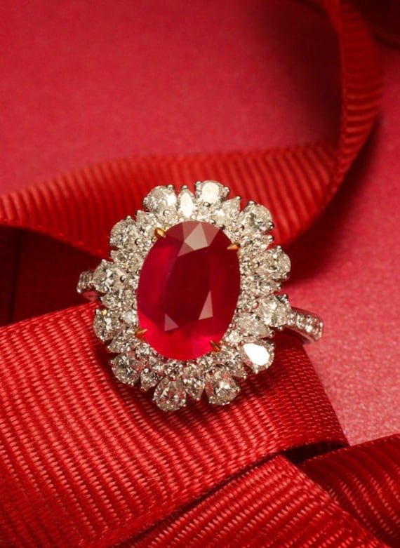 * Condition: Brand new * Center Stone: Natural Ruby from Mozambique, Oval Cut, 10x12mm, Approx 3.2ct (Heat Treatment) Natural White Diamond, Round Cut & Pear Cut, 1.61ct in total (VVS clarity with F color) * Ring Weight: 5.95g (Actual weight depends the ring size) * Metal Purity: 18K Solid White Gold (Optional) * Free DHL Express Shipping. * Attached with Certificate. * Each piece is made-to-order with care and special attention to detail.  all items are made with conflict-free diamonds and gems Pigeon Blood Ruby Engagement Ring, Ballerina Ring, Oval Cut Diamond Rings, Blood Ruby, Handmade Gold Ring, Luxury Jewelry Box, Oval Cut Diamond, Cute Rings, Color Ring