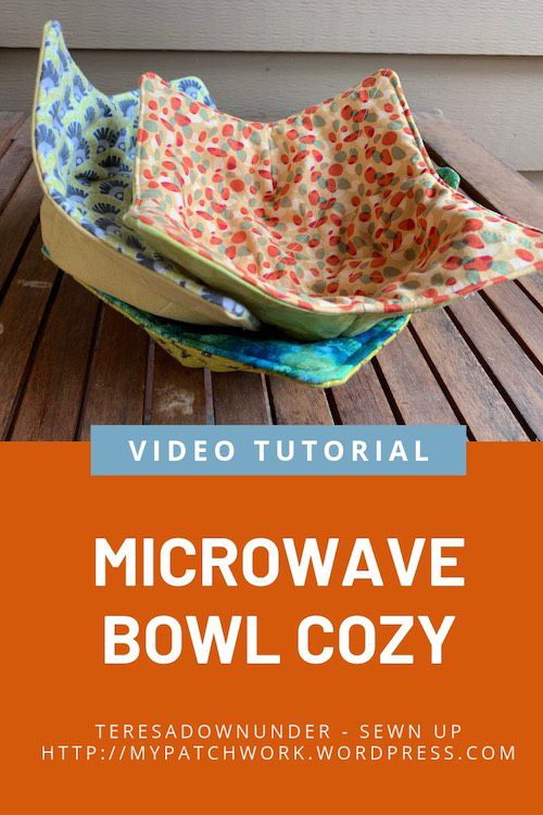 a bowl sitting on top of a wooden table next to a window with the words microwave bowl cozy