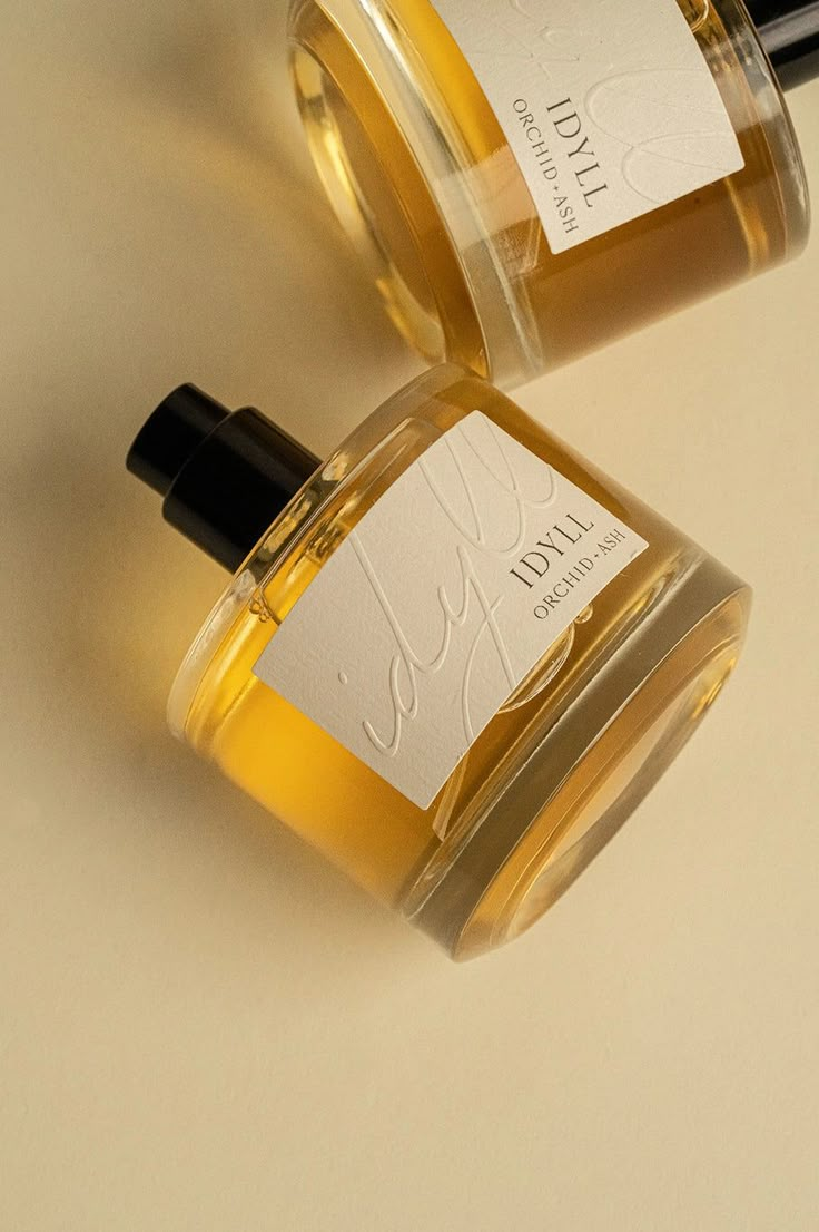 IDYLL beckons to evenings of endless sunlight, capturing the warm embrace of a sunset in its notes of jasmine incense and vanilla musk. Earthy and enchanting, a mischievous whisper rises amidst its bergamot and plum top notes, its cedar and musk undertones. This fragrance is meticulously crafted with clean ingredients: denatured alcohol, water, and non-toxic fragrance – free of parabens, phthalates, toxins, synthetic colors, gluten, and animal products. Weightless 1.7 oz. and 50 ml, this vegan and 100% non-toxic perfume is simply sublime. Non Toxic Perfume, Jasmine Incense, Perfume Branding, Fragrance Lab, Fragrance Photography, Musk Perfume, Perfume Bottle Design, Fragrances Perfume Woman, Vanilla Perfume