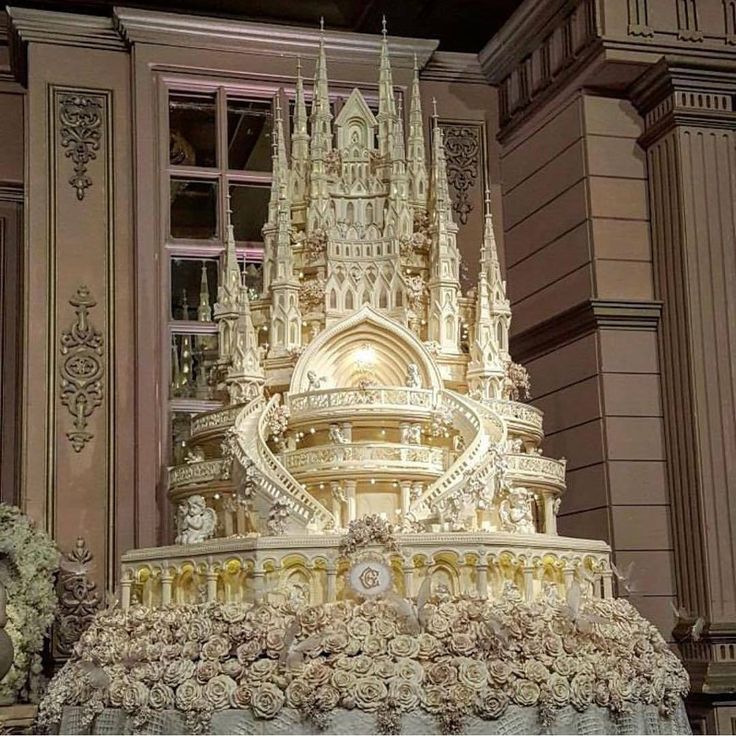 an elaborately decorated fountain in front of a window