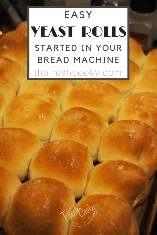 bread rolls sitting on top of a baking sheet with the words easy yeast rolls started in your bread machine